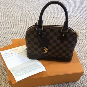 Authentic Louis Vuitton alma bb damier ebene with box, dustbag +strap.